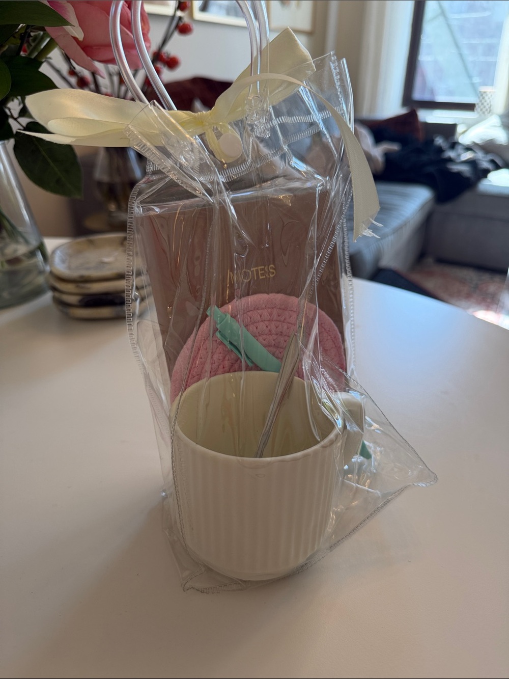 gift set with a mug, pen, spoon, notepad and hot pad